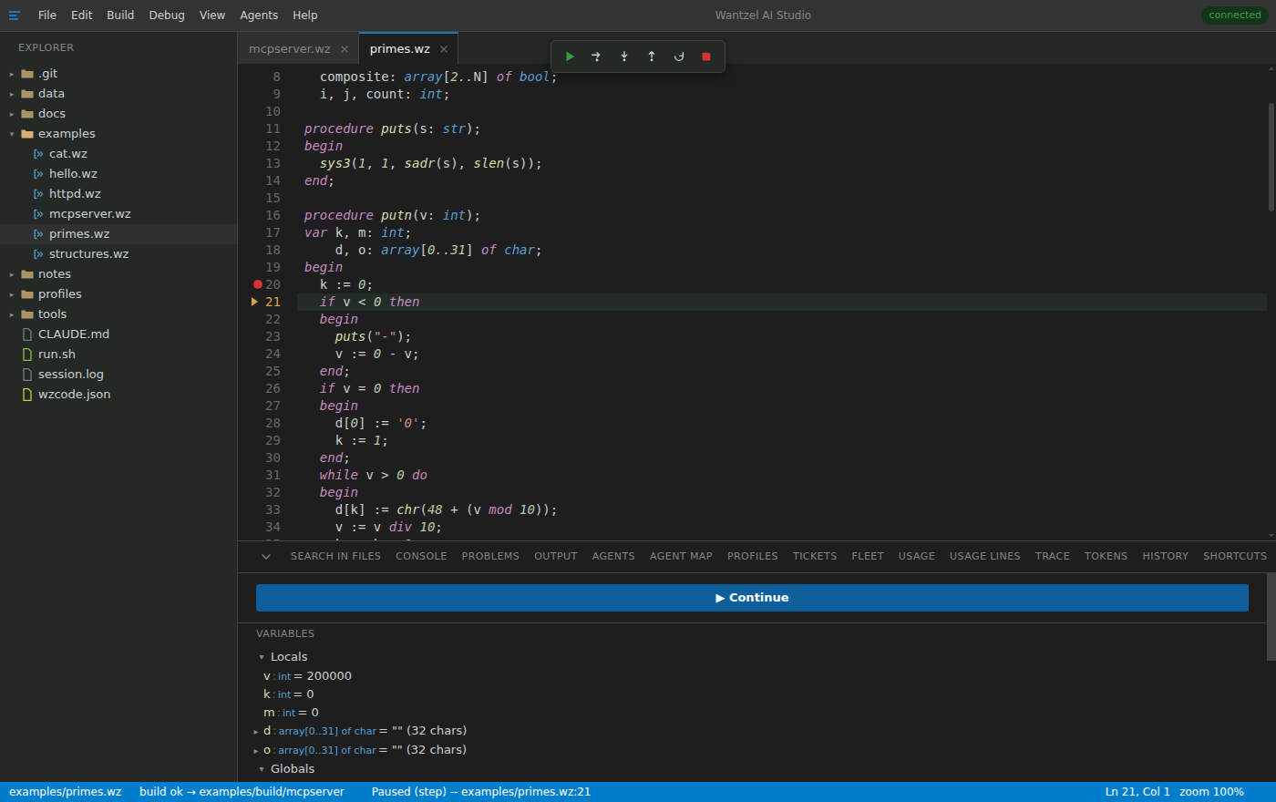 The debugger paused in primes.wz after a step from the breakpoint on line 20: the step bar at the top, the current line 21 marked, and the Variables view with the locals v = 200000, k and m.
